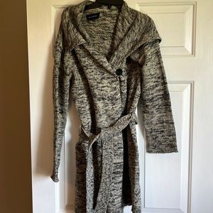 The limited inside button closure wrap sweater